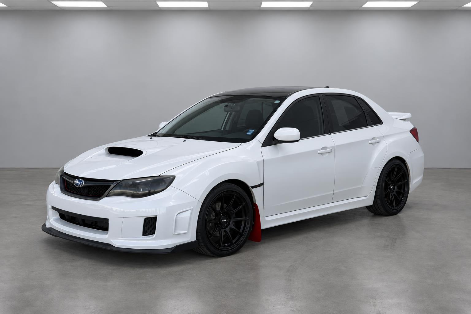 2011 Subaru Impreza WRX, front three-quarter